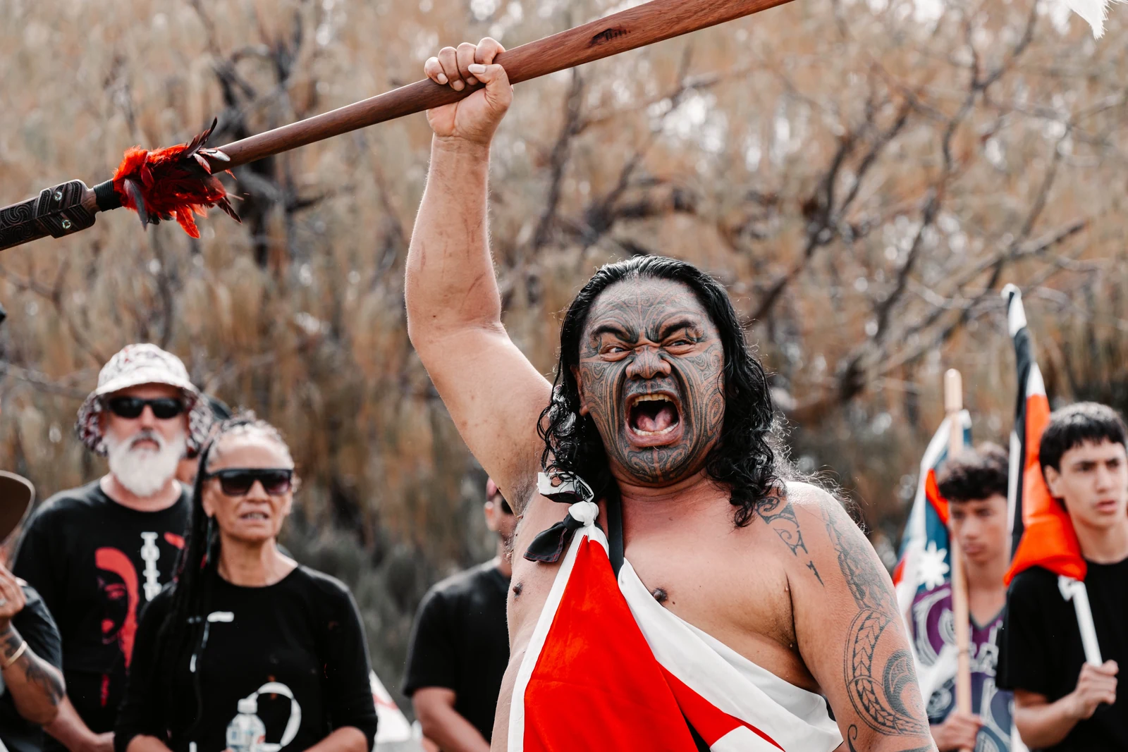 Maori man holding a taiaha